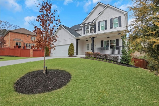 view of front of property featuring a front lawn, board and batten siding, a porch, and fence