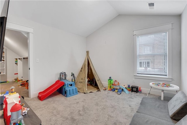 game room with lofted ceiling, carpet, visible vents, and baseboards