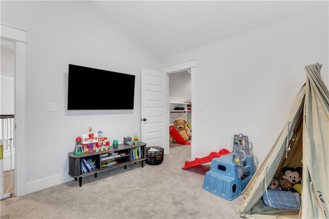 recreation room with carpet floors and lofted ceiling