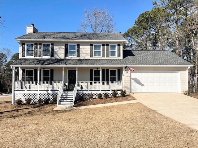 colonial home featuring a garage, a front lawn, and a porch