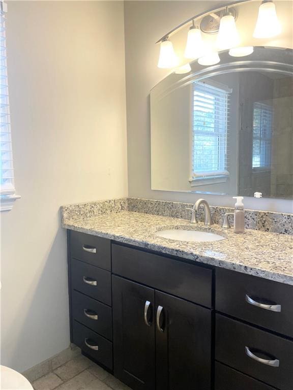 bathroom featuring vanity and tile patterned flooring