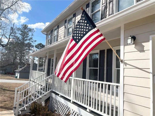 view of side of home featuring a porch