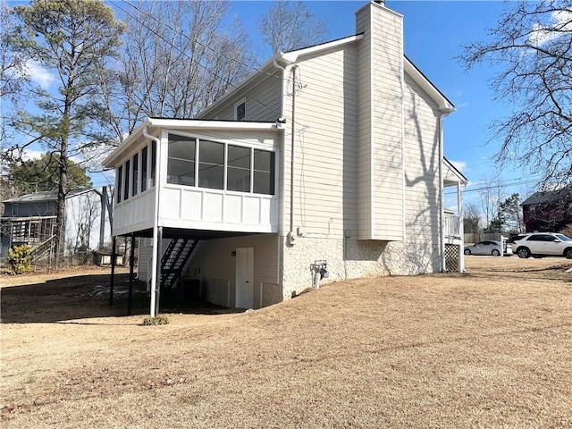 rear view of house with a sunroom