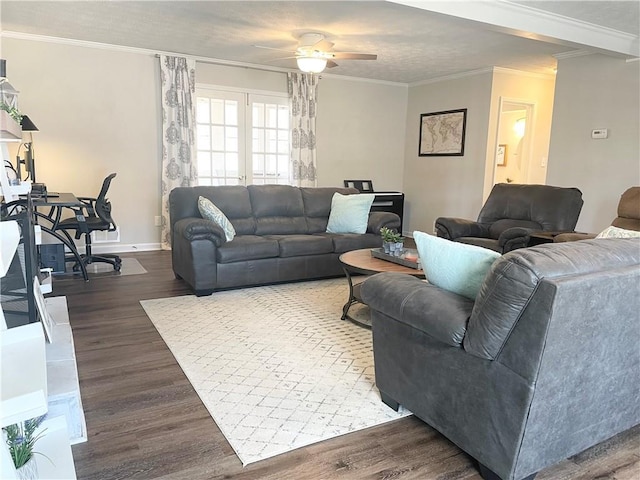 living room featuring dark wood-type flooring, ceiling fan, and ornamental molding