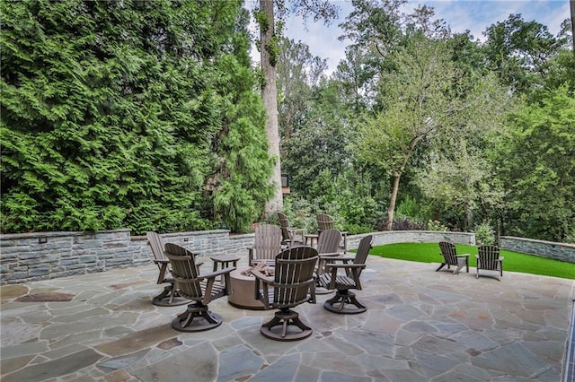 view of patio / terrace with an outdoor fire pit