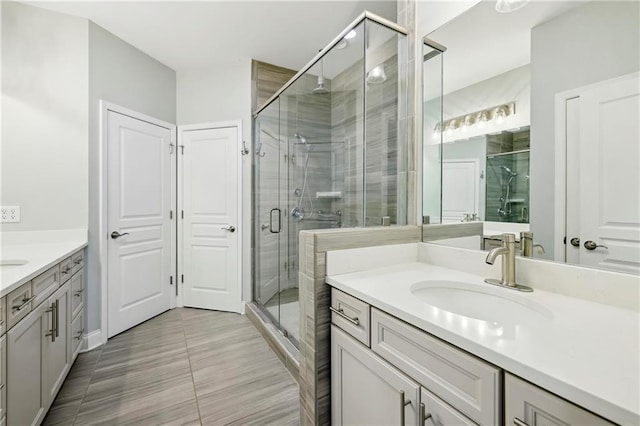146 Rowan Ave, Alpharetta, GA 30009 - bathroom featuring a sink, two vanities, and a shower stall