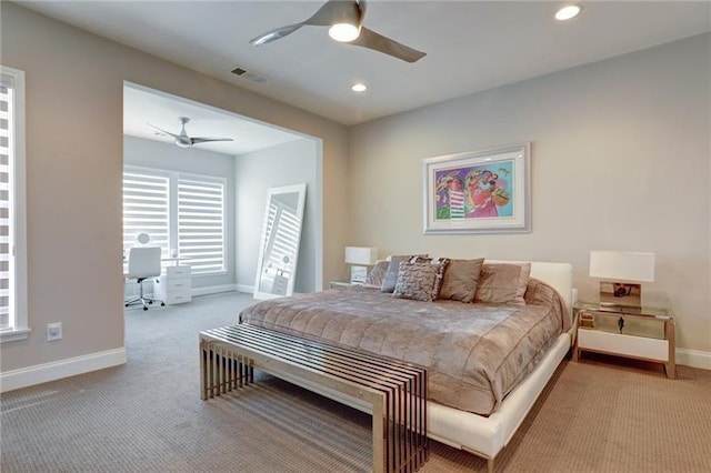 carpeted bedroom with ceiling fan, recessed lighting, visible vents, and baseboards