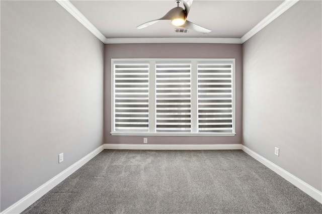 unfurnished room featuring ceiling fan, carpet flooring, visible vents, baseboards, and crown molding