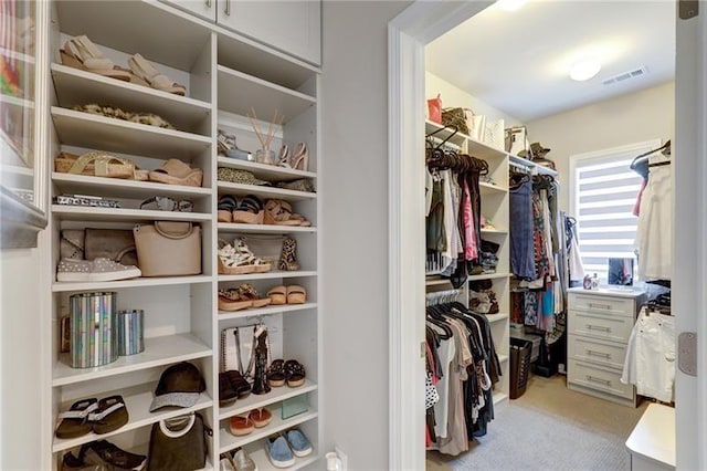 spacious closet featuring light carpet and visible vents