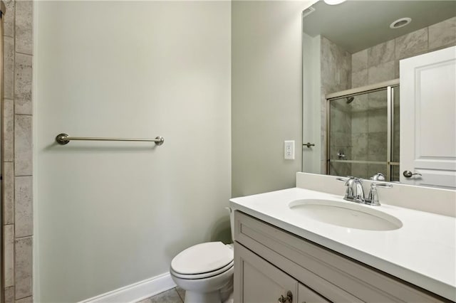 146 Rowan Ave, Alpharetta, GA 30009 - bathroom with a shower stall, baseboards, vanity, and toilet