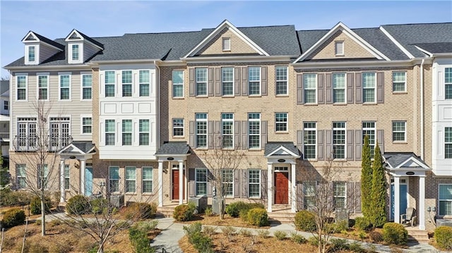 view of property with brick siding