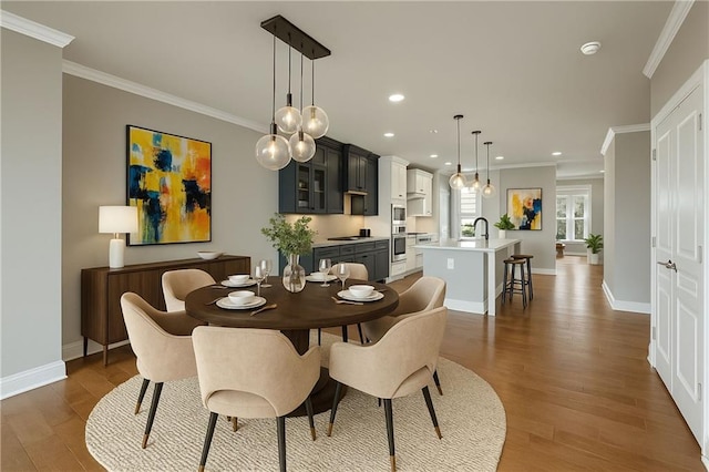 146 Rowan Ave, Alpharetta, GA 30009 - dining room featuring crown molding, wood finished floors, baseboards, and recessed lighting
