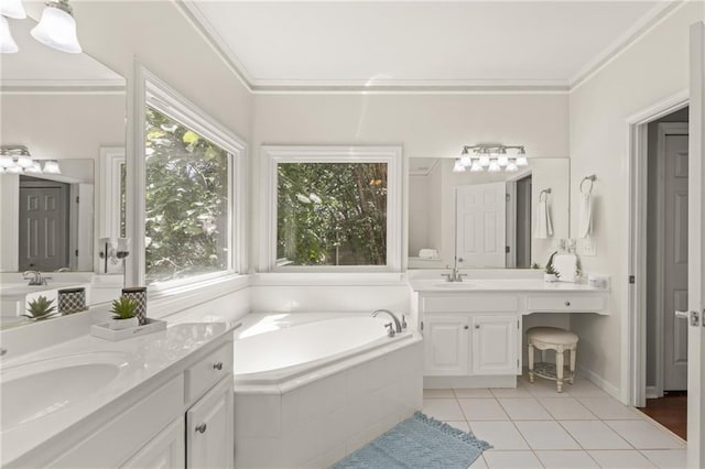 bathroom with ornamental molding, vanity, tile patterned flooring, and tiled tub