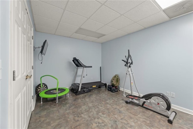 workout room featuring a paneled ceiling