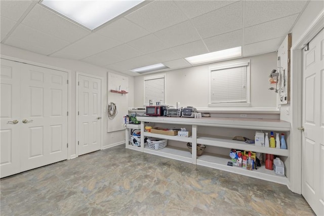 basement featuring a drop ceiling