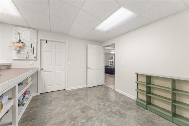 basement featuring a paneled ceiling