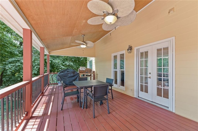 wooden deck featuring french doors and ceiling fan