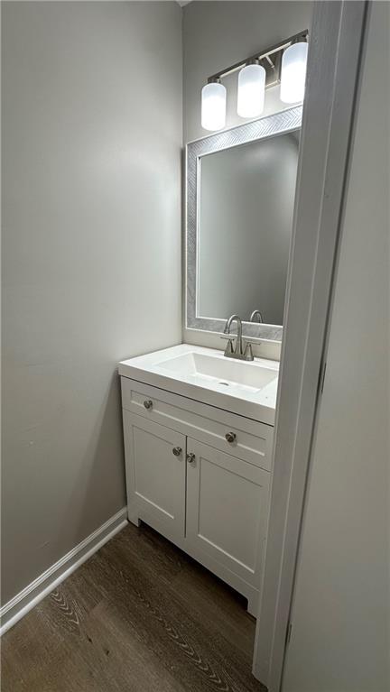 336 Shady Lane Cir, Canton, GA 30115 - bathroom with wood finished floors, vanity, and baseboards