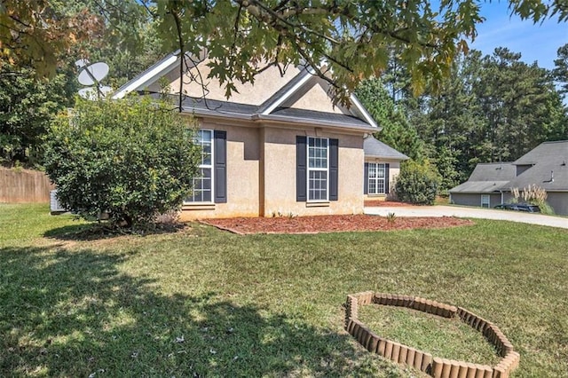 view of front of property with a front lawn