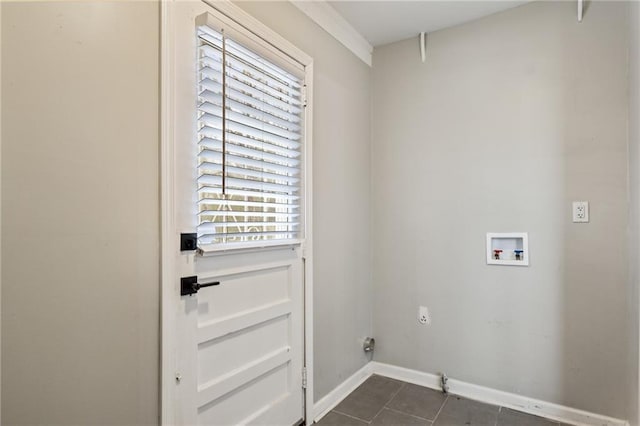 laundry area with dark tile patterned flooring, hookup for a washing machine, and electric dryer hookup