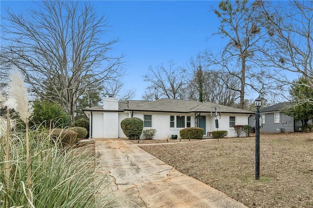 ranch-style home featuring a garage