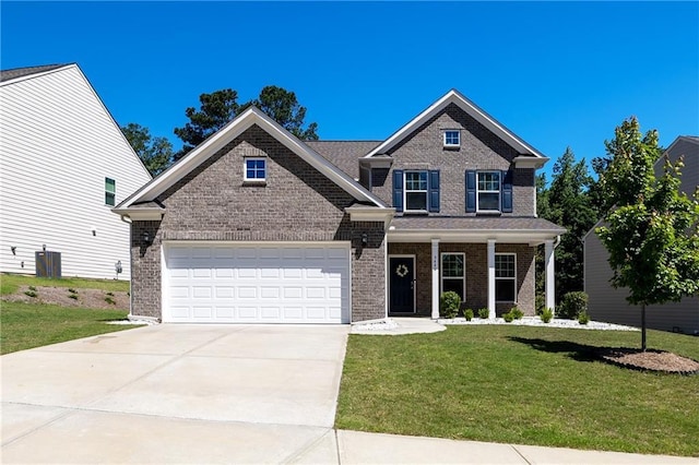5440 Wheeler Ridge Rd, Auburn, GA 30011 - view of front of home with driveway, brick siding, a front lawn, a garage, and covered porch