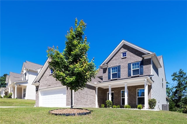 5440 Wheeler Ridge Rd, Auburn, GA 30011 - view of front of property with brick siding, an attached garage, central AC, a front yard, and a porch