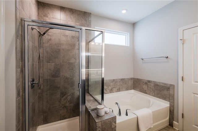 5440 Wheeler Ridge Rd, Auburn, GA 30011 - bathroom with a garden tub and a shower stall