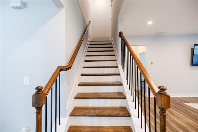 5440 Wheeler Ridge Rd, Auburn, GA 30011 - staircase with recessed lighting and wood finished floors