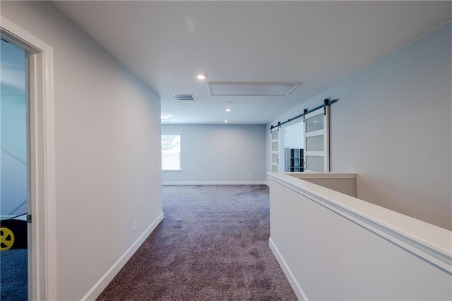 5440 Wheeler Ridge Rd, Auburn, GA 30011 - hallway with attic access, carpet flooring, baseboards, recessed lighting, and a barn door
