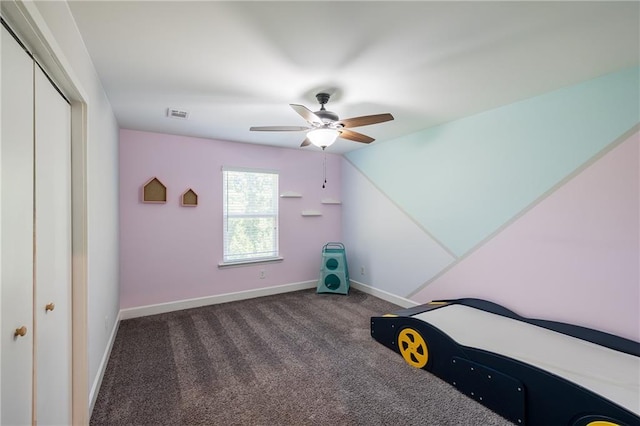 5440 Wheeler Ridge Rd, Auburn, GA 30011 - unfurnished bedroom with carpet flooring, baseboards, a ceiling fan, and a closet