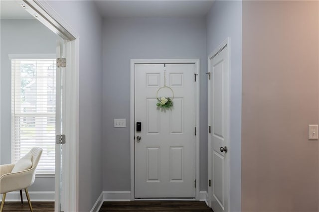 5440 Wheeler Ridge Rd, Auburn, GA 30011 - foyer entrance with dark wood-style flooring and baseboards