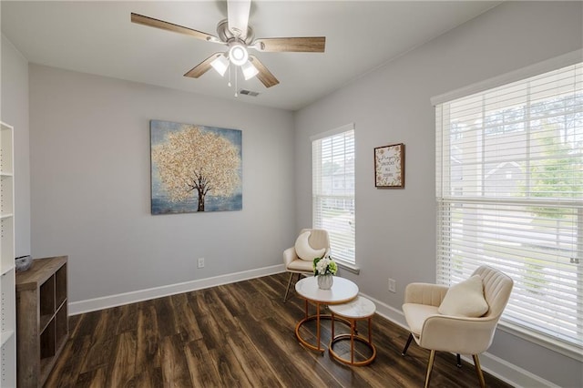 5440 Wheeler Ridge Rd, Auburn, GA 30011 - living area featuring wood finished floors, a ceiling fan, and baseboards