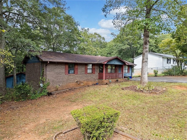 view of front of home featuring a porch and a front yard