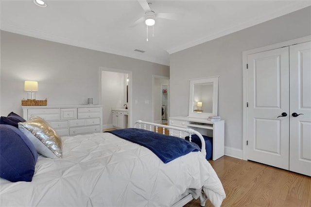 bedroom featuring visible vents, light wood-style floors, crown molding, baseboards, and ceiling fan