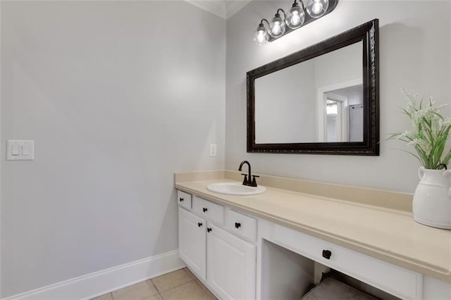 bathroom featuring baseboards, tile patterned flooring, and vanity