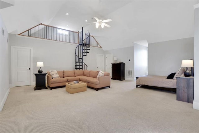 living room featuring high vaulted ceiling, stairs, ceiling fan, carpet, and visible vents