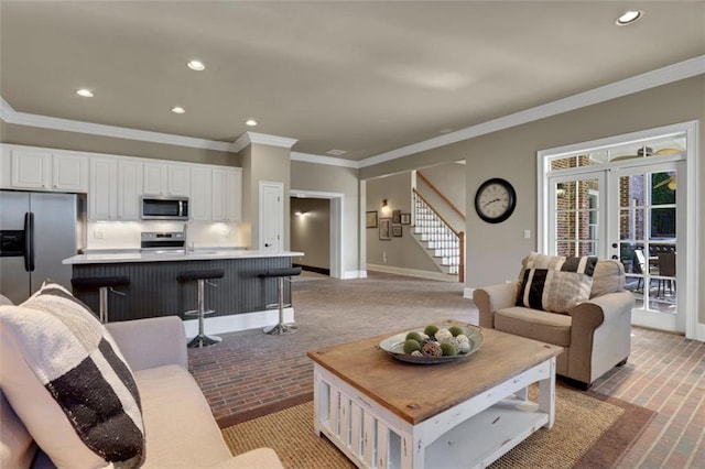 living area with recessed lighting, brick floor, stairway, and baseboards