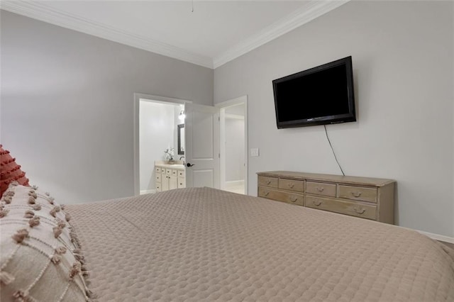 bedroom featuring crown molding and ensuite bathroom