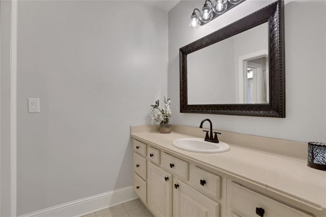 bathroom featuring baseboards, vanity, and tile patterned flooring