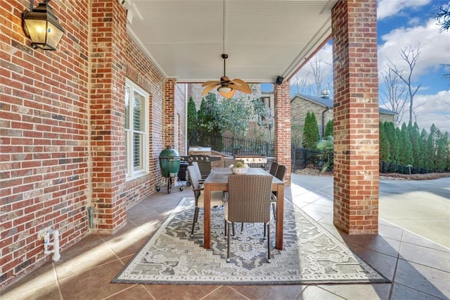 view of patio / terrace featuring fence, a ceiling fan, outdoor dining area, and a grill