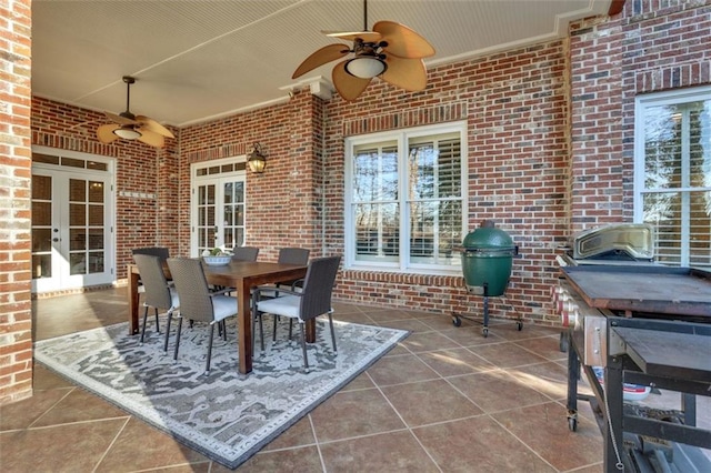 view of patio / terrace featuring ceiling fan, outdoor dining area, french doors, and area for grilling