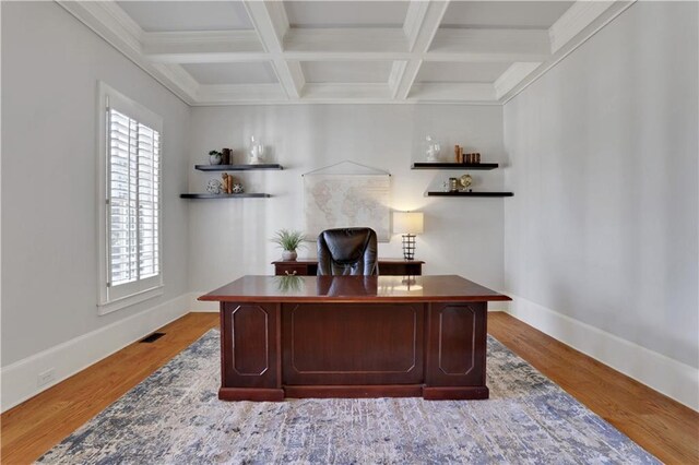 home office featuring coffered ceiling, visible vents, beam ceiling, and a healthy amount of sunlight