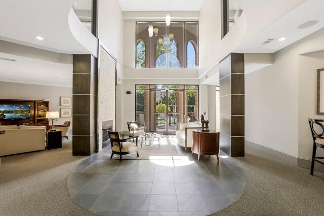 3621 Vinings Slope SE Unit 1537, Atlanta, GA 30339 - community lobby with a high ceiling and recessed lighting