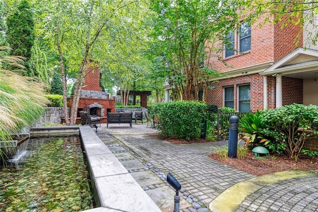 view of property's community with a patio