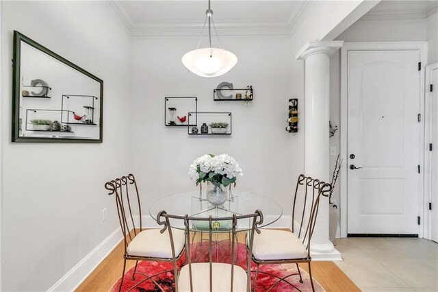 3621 Vinings Slope SE Unit 1537, Atlanta, GA 30339 - dining room featuring decorative columns, crown molding, and baseboards