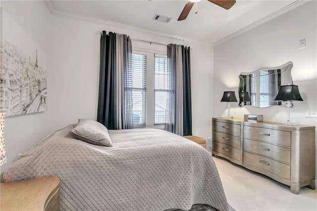 bedroom featuring ceiling fan, light colored carpet, and crown molding