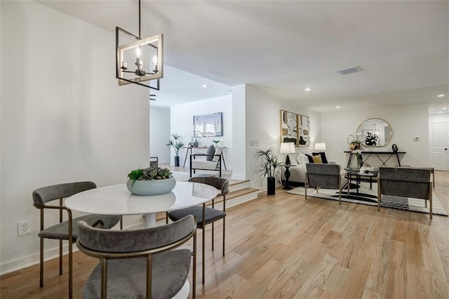 dining area with visible vents, recessed lighting, a chandelier, light wood-style flooring, and baseboards