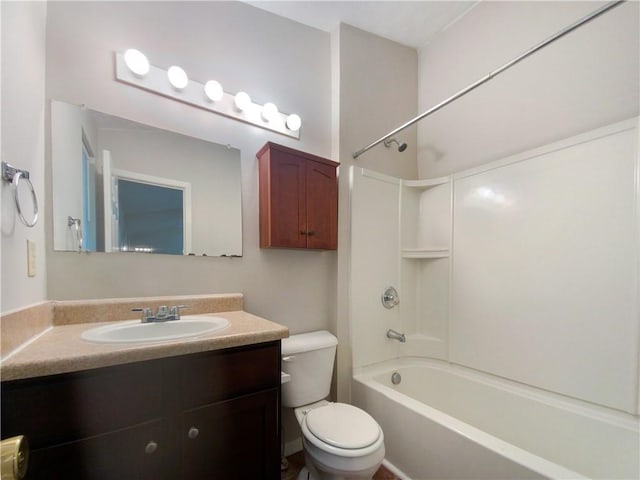 full bathroom featuring vanity, washtub / shower combination, and toilet