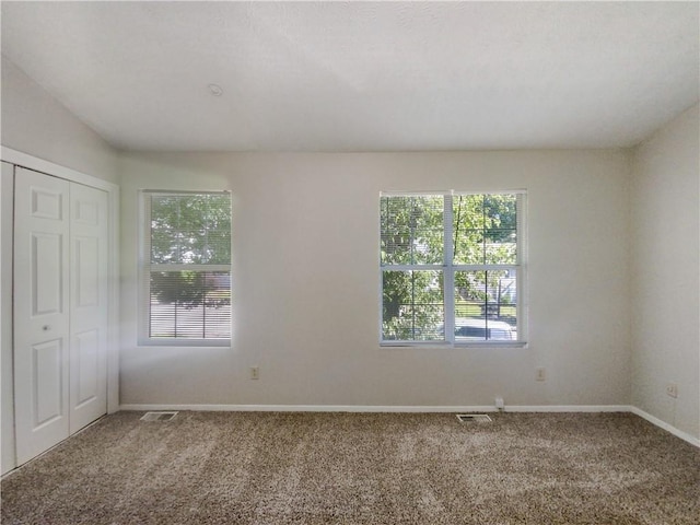 empty room with carpet flooring